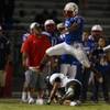 Photo: Liberty running back Niko Kapeli leaps over Palo V Photo: Liberty running back Niko Kapeli leaps over Palo V